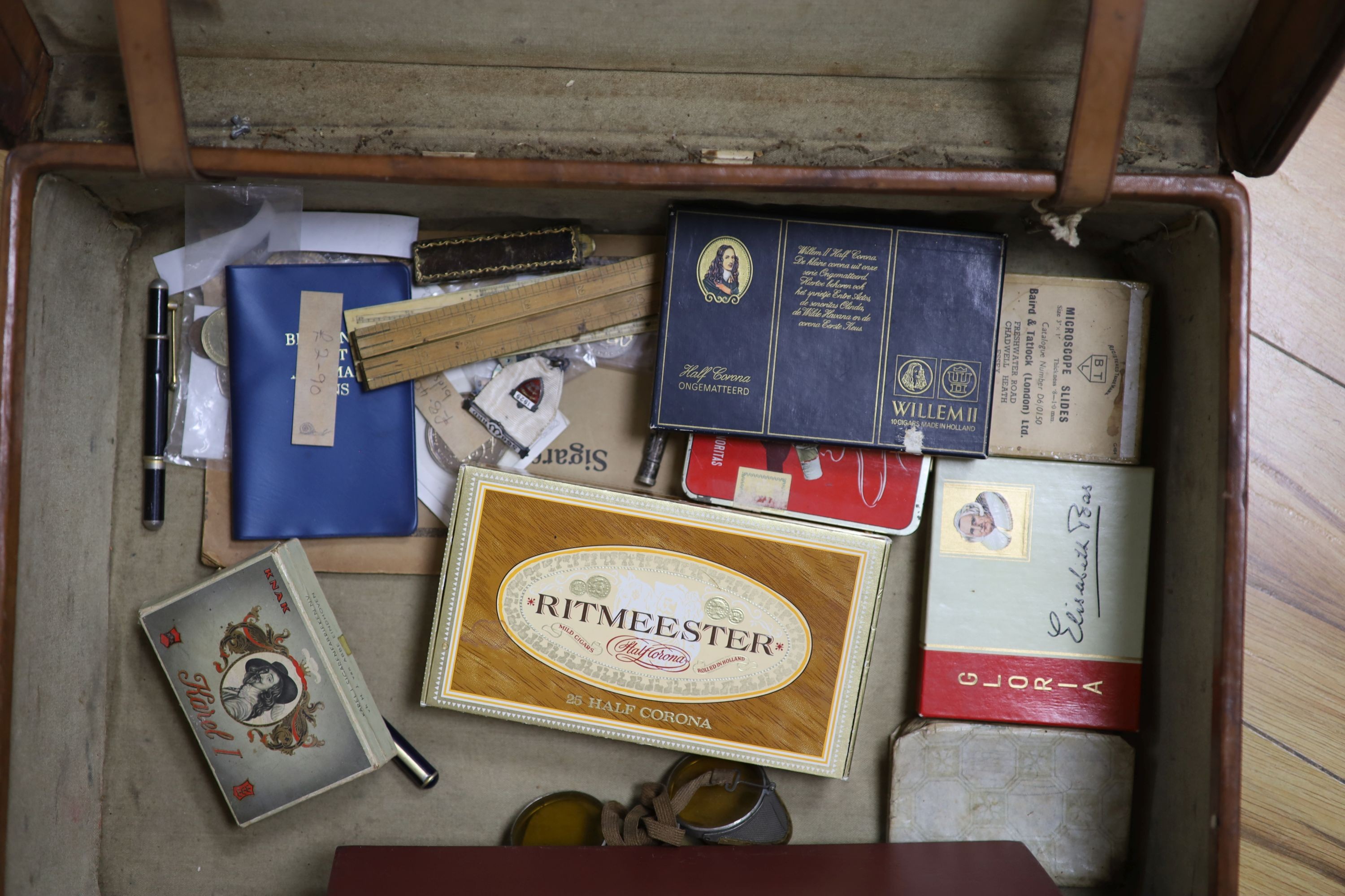Cigar ephemera and mixed collectables in a leather suitcase